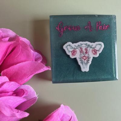 Handmade soap that reads Grow a pair with ovaries made by flowers